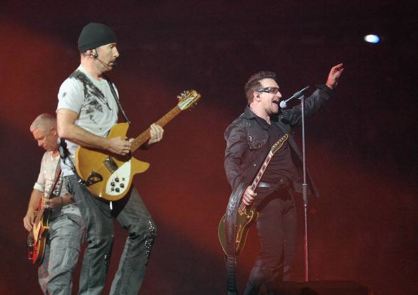 EAST RUTHERFORD, NJ - JULY 20: (L-R) U2 bass player Adam Clayton, guitar player The Edge and lead singer Bono perform at the New Meadowlands Stadium on July 20, 2011 in East Rutherford, New Jersey.  (Photo by Mike Coppola/Getty Images)