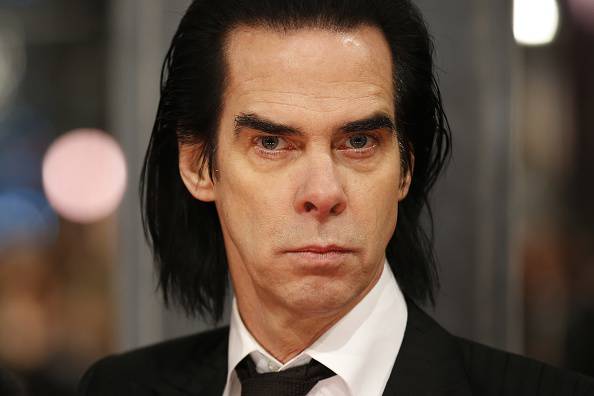 British musician Nick Cave poses on the red carpet for the BAFTA British Academy Film Awards at the Royal Opera House in London on February 8, 2015. AFP PHOTO / JUSTIN TALLIS        (Photo credit should read JUSTIN TALLIS/AFP/Getty Images)