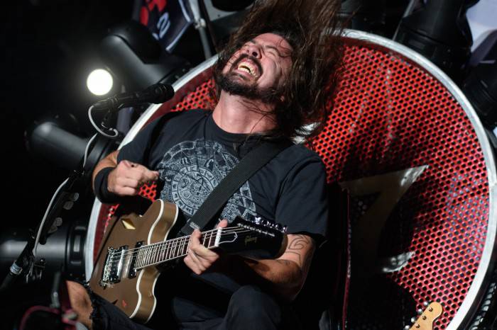 Dave Grohl of the band Foo Fighters performs at the Ansan Valley Rock Festival in Ansan, south of Seoul on July 26, 2015. The Ansan Valley Rock Festival is an annual music festival featuring a mix of regional and international acts. RESTRICTED TO EDITORIAL USE AFP PHOTO / Ed Jones        (Photo credit should read ED JONES/AFP/Getty Images)