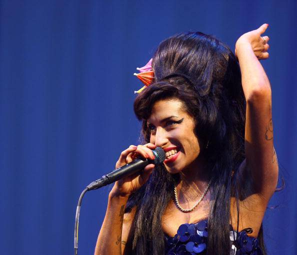 British singer Amy Winehouse performs at the Glastonbury Festival at Worthy Farm, in Glastonbury on June 28, 2008. AFP PHOTO/BEN STANSALL (Photo credit should read BEN STANSALL/AFP/Getty Images)
