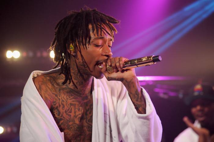 NEW YORK, NY - AUGUST 13:  Wiz Khalifa performs onstage at the iHeartRadio Live P.C. Richard & Son Theater on August 13, 2014 in New York City.  (Photo by Bryan Bedder/Getty Images for Clear Channel)
