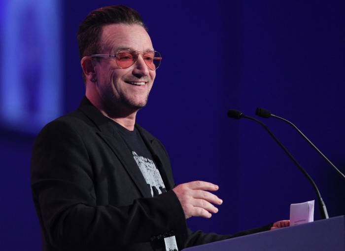 Irish singer and frontman of U2, Bono addresses delegates at the Dublin Convention Centre in Dublin, Ireland, on March 7, 2014 during The European Peoples Party (EPP) conference.  The European Peoples Party (EPP) conference will conclude with a vote by over 800 Congress delegates to elect the EPP candidate for President of the European Commission to succeed Jose Manuel Barroso as President of the European Commission. AFP PHOTO / PETER MUHLY        (Photo credit should read PETER MUHLY/AFP/Getty Images)