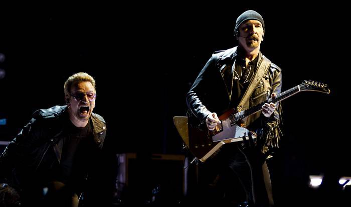 Irish band U2 perform at the Ziggo Dome in Amsterdam on September 8, 2015, part of their "iNNOCENCE + eXPERIENCE" Tour 2015.  AFP PHOTO / ANP / PAUL BERGEN ***NETHERLANDS OUT***        (Photo credit should read PAUL BERGEN/AFP/Getty Images)