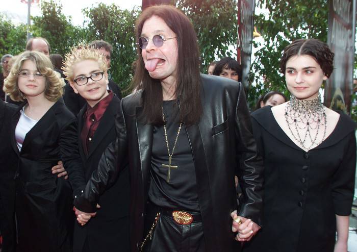 LOS ANGELES, UNITED STATES:  British Metal Artist Ozzy Osbourne (C) arrives at the 42nd Grammy Awards Ceremony with his family in Los Angeles, CA, 23 February, 2000.          Osbourne's group "Black Sabbath" won a Grammy for Best Metal Performance for the song "Iron Man" on the album "Reunion". (ELECTRONIC IMAGE) AFP PHOTO/Lucy NICHOLSON/ln (Photo credit should read LUCY NICHOLSON/AFP/Getty Images)
