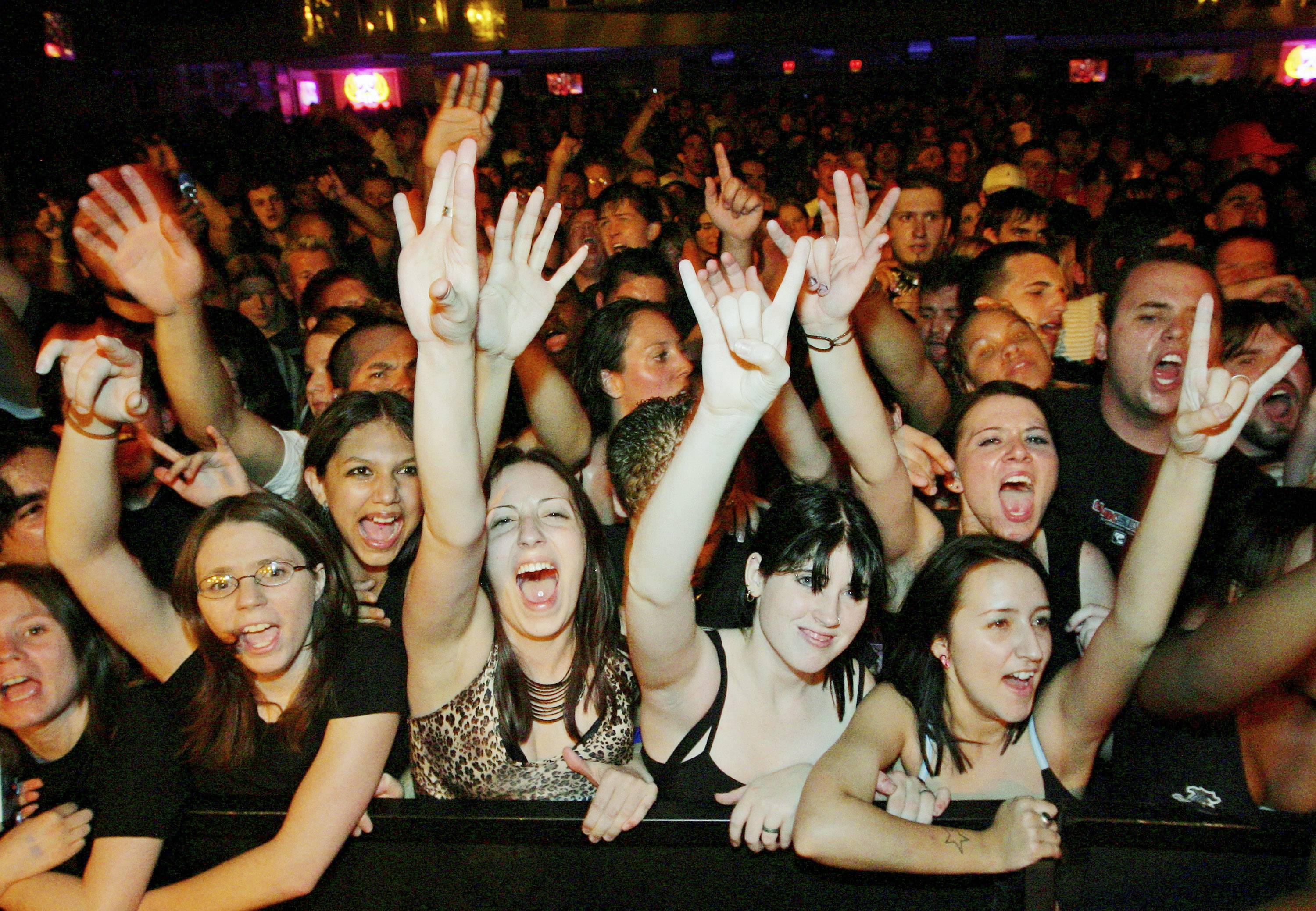 LAS VEGAS - AUGUST 05:  Fans react as Papa Roach performs at The Joint inside the Hard Rock Hotel & Casino August 5, 2005 in Las Vegas, Nevada. The rock group is touring in support of the platinum-selling album "Getting Away With Murder."  (Photo by Ethan Miller/Getty Images)