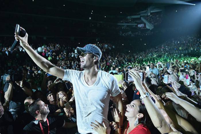 NEWARK, NJ - SEPTEMBER 12:  Enrique Iglesias and Pitbull with special guest J Balvin perform at opening night of U.S. tour at Prudential Center on September 12, 2014 in Newark, New Jersey.  (Photo by Theo Wargo/Getty Images for AEG Live)