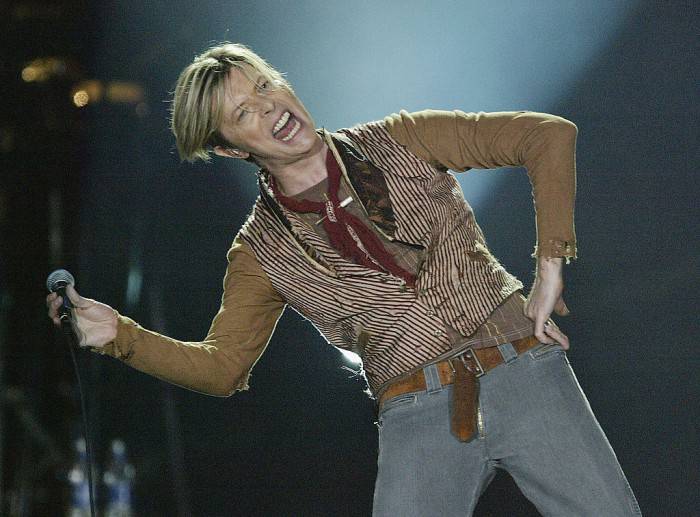 MANCHESTER, ENGLAND - NOVEMBER 17:  David Bowie performs on the first night of his UK tour at the MEN Arena on November 17, 2003 in Manchester, England. (Photo by Alex Livesey/Getty Images)