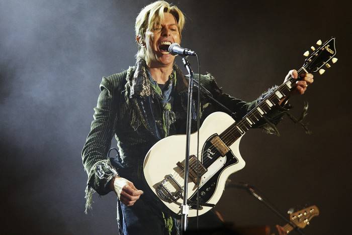 NEWPORT, ENGLAND - JUNE 13:  David Bowie performs on stage on the third and final day of "The Nokia Isle of Wight Festival 2004" at Seaclose Park, on June 13, 2004 in Newport, UK. The third annual rock festival takes place during the Isle of Wight Festival which runs from June 4-19.  (Photo by Jo Hale/Getty Images)