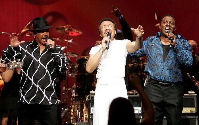 LOS ANGELES - DECEMBER 11:  Singers Ralph Johnson, (L) Maurice White, (C) and Philip Bailey of the band Earth, Wind and Fire perform during the inaugural "Grammy Jam Fest" at the Wiltern Theatre December 11, 2004 in Los Angeles, California. The event celebrated the music of Earth, Wind and Fire and raised funds for various arts charities.   (Photo by Carlo Allegri/Getty Images)