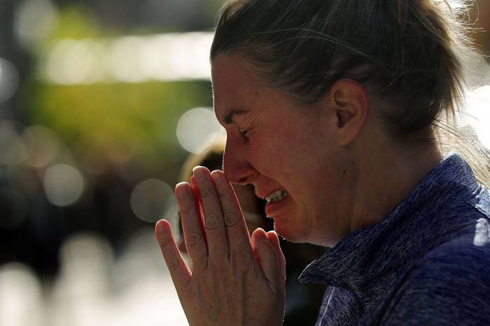 NEW YORK, NY - NOVEMBER 14:  A woman cries outside of the Consulate General of France in New York the day after an attack on civilians in Paris on November 14, 2015 in New York City. At least 100 people were killed in a popular Paris concert hall, one of at least 6 terror attacks in the French capital. The French president Francois Hollande closed French borders following the attacks.  (Photo by Spencer Platt/Getty Images)