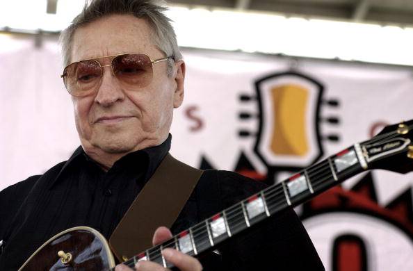 MEMPHIS - JULY 5:  Musician Scotty Moore performs for the crowd at the 50th Anniversary of Rock 'N Roll Reunion celebration on July 5, 2004 at Sun Studio in Memphis, Tennessee. Moore, recently names one of the 50 greatest guitarist of all time by Rolling Stone magazine, played lead guitar on all of Elvis Presley Sun Records recordings.  (Photo by Mike Brown/Getty Images)