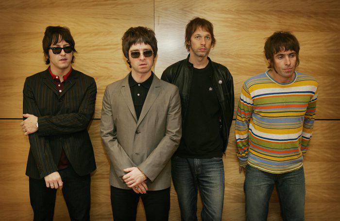 (FILES) (From L) Members of the British rock band "Oasis" Gem, Noel Gallagher, Andy Bell and Liam Gallagher hold a photocall in Hong Kong on February 25, 2006. The future of British rock group Oasis was plunged into doubt on August 28, 2009 after lead guitarist Noel Gallagher dramatically announced he was quitting because he can no longer work with his brother Liam.   AFP PHOTO/MIKE CLARKE (Photo credit should read MIKE CLARKE/AFP/Getty Images)